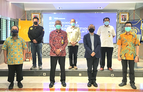 A photo taken after a research presentation session at the Faculty of Engineering, University of Indonesia